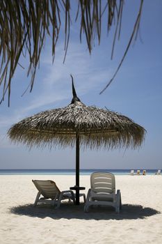 Parasol providing shade on a hot beach