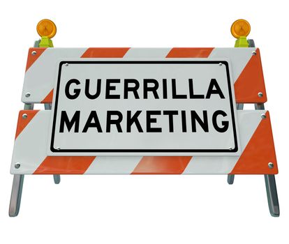 The words Guerrilla Marketing on a barricade or barrier to illustrate uncommon business tactics and campaigns for attracting customers and building awareness with underground methods