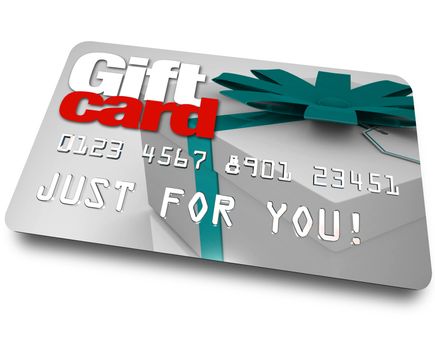 The words Gift Card on a plastic credit or debit card used for buying merchandise from a store as a gift or special present