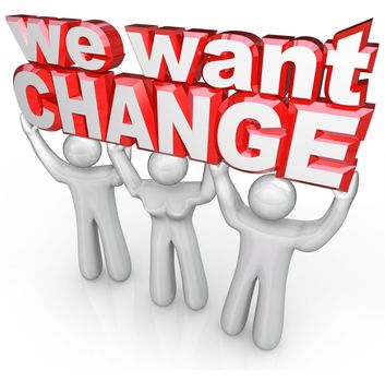 Three people lift up the words We Want Change to demonstrate their demands that things improve and a team effort leads to success rather than same old results