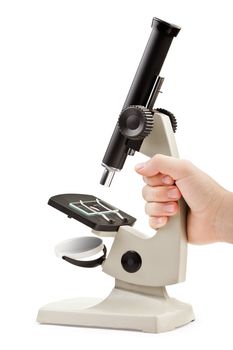 Human hand holding science laboratory or medical research microscope equipment white isolated