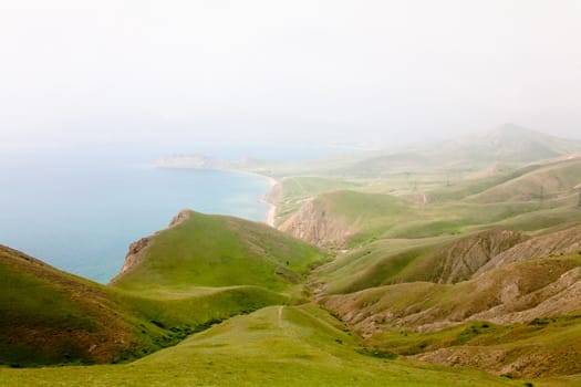 A summer landscape with sea and mountains
