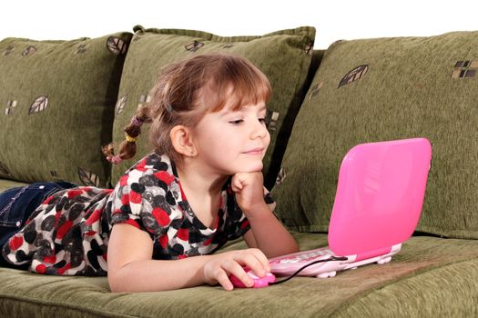 little girl play with laptop