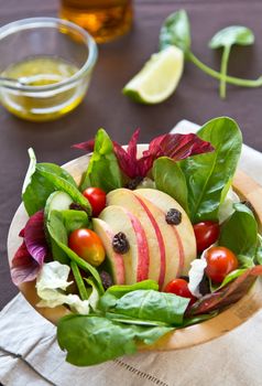 Apple,cherry tomato  with raisin and spinach salad