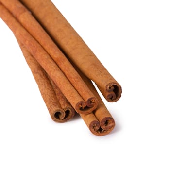 Several cinnamon sticks isolated on white background