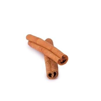 Two cinnamon sticks isolated on white background