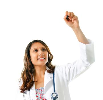 Asian Indian female doctor drawing over white background. Medical concept.