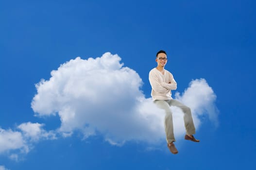 Full body Asian man sitting on a cloud over blue sky