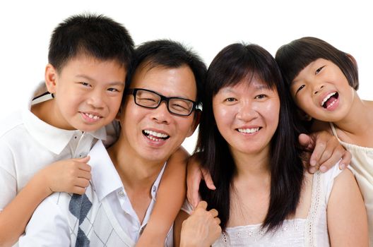 Portrait of happy Asian family isolated on white background