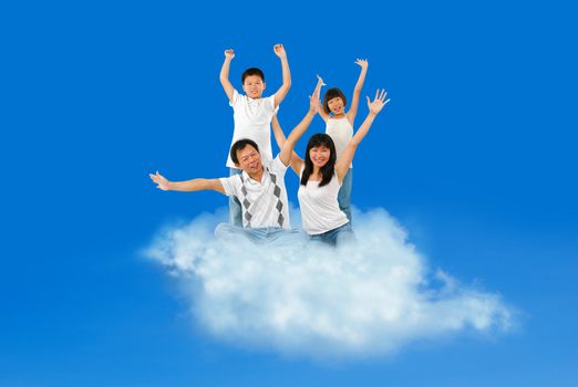 Happy Asian family traveling on cloud over blue sky