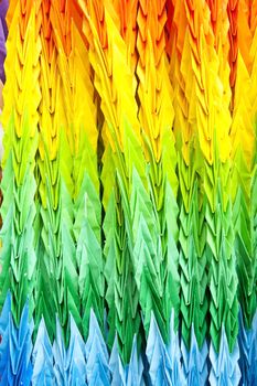 Colorful chains of origami cranes remind of a nuclear blast in Nagasaki, Japan