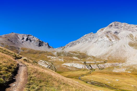 Hiking footpath in The South Alps (Alpes du Haute Provence),in France, leading to the Small Cayolle Mountain Pass (Col de la Petit Cayolle- 2639 m)