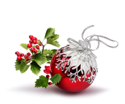 Red Christmas ball with hawthorn berries branch, isolated on white