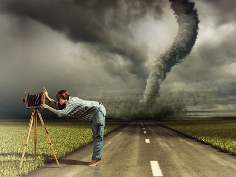 woman, taking photo by vintage camera and tornado (Photo compilation. Photo and hand-drawing elements combined. The grain and texture added.)
