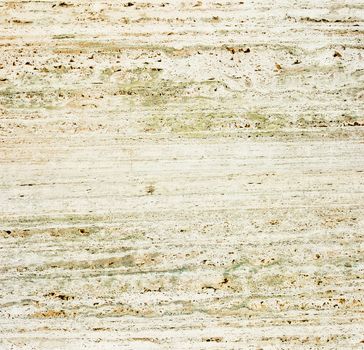 Beige textured travertine close-up photo