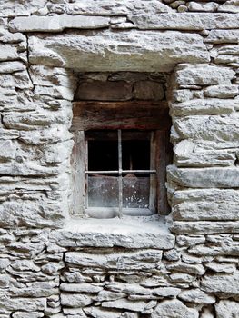 old window in stone wall