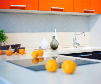 kitchen interior with fruits and dishes on countertop (beautiful Depth Of Field effect) 