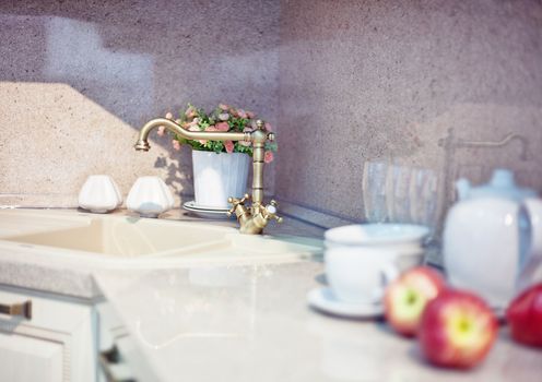 kitchen interior with fruits and dishes on countertop (beautiful Depth Of Field effect) 