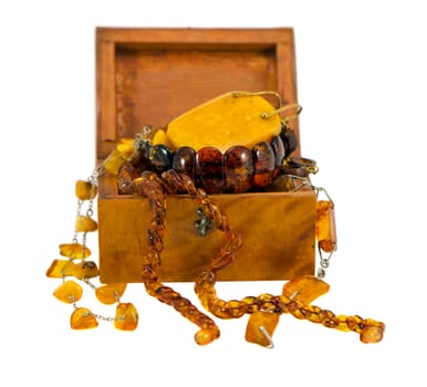 Amber apparel jewelry in retro wooden box isolated on white background