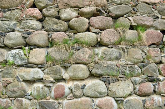 Backdrop of retro castle stone wall and grass grow.