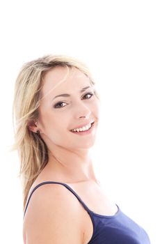 Smiling beautiful confident woman with an upright posture standing sideways and looking at the camera isolated on white 