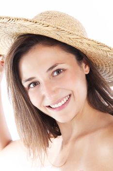Closeup portrait of a smiling friendly woman in a straw sunhat isolated on white Closeup portrait of a smiling friendly woman in a straw sunhat isolated on white