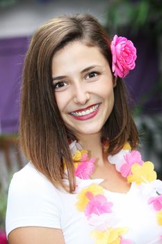 Beautiful woman wearing the welcoming floral garland and flower in her hair traditional of the hospitality on tropical island getaways Beautiful woman wearing the welcoming floral garland and flower in her hair traditional of the hospitality on tropical islandon getaways 
