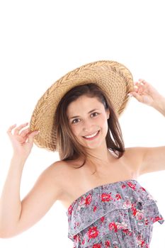 Smiling woman in a strapless sundress and straw sunhat dressed for summer fashion Smiling woman in a strapless sundress and straw sunhat dressed for summer fashion