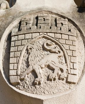 Arms of Lviv city, Ukraine, in stone with gateway and lion