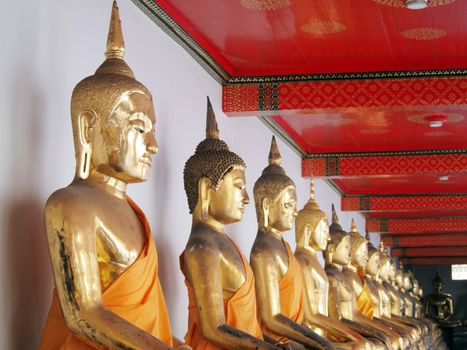 Buddha in corridor of light in wat pho temple,bangkok,thailand      