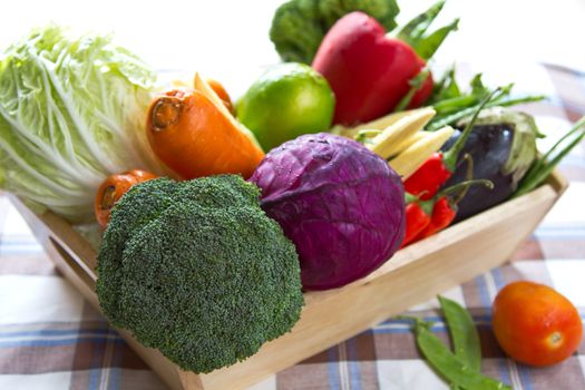 Fresh varieties of Vegetables in wood tray