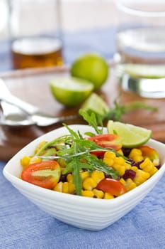Yellow and purple Sweetcorn with rocket salad