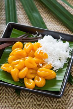Sweet dumpling made of rice and sticky rice flour,palm in syrup with grated coconut