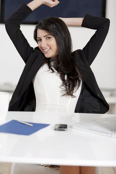 Young woman working at her desk in the office