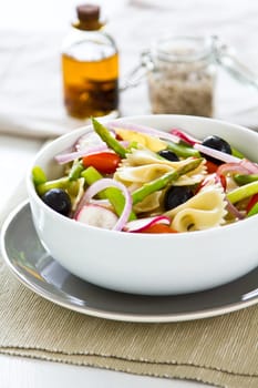 Pasta Farfalle with asparagus ,radish,and black olive salad