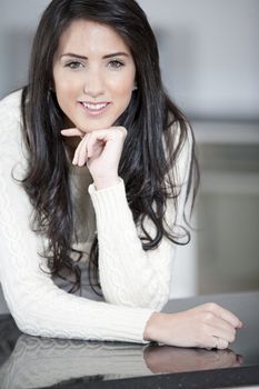 Young woman relaxing in the kitchen at home