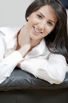 Young woman lying on sofa at home