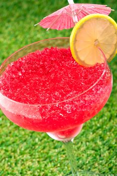 Strawberry Watermelon Daiquiri decorated with lemon and umbrella