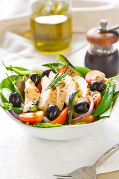 Grilled chicken with pea ,black olive and pepper salad