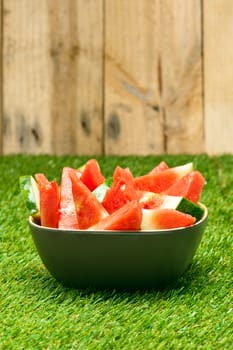 Bowl of cut watermelon slices in nice summer colors
