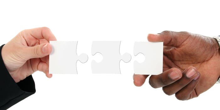 Hands And Puzzle Pieces Isolated On White 