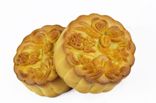 Mooncake cutted with lotus seed paste and yolk inside, isolated white background