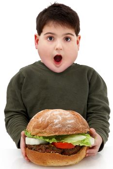 Hungry obese child with giant hamberger over white.