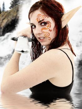 Live action role play character in costume in lake dressed as fantasy warrior elf.