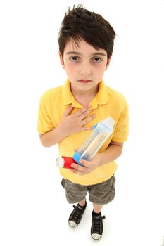 Young asthmatic child with inhaler and spacer chamber over white background.