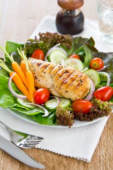 Grilled chicken with lettuce,cherry tomato and baby carrot salad