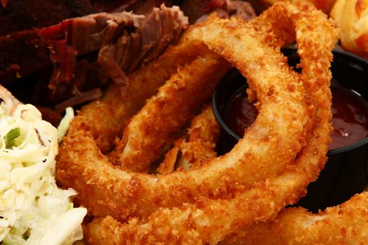 Close Up Onion Rings and BBQ Sauce in Plate.