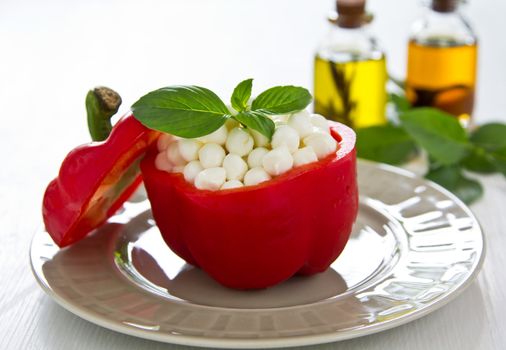 Pearl Mozzarella with basil in Red pepper by chilli oil and salt