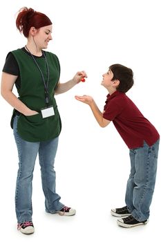 Attractive 19 year old grocery cleck woman sharing cherries with hungry excited 8 year old boy child over white.  Full length over white.