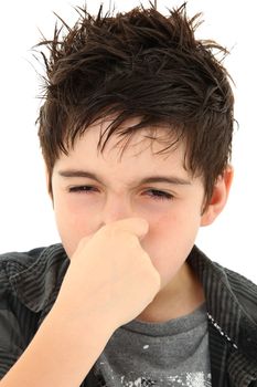 Adorable young boy making allergy stinky face expression over white.